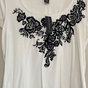 White and black top.